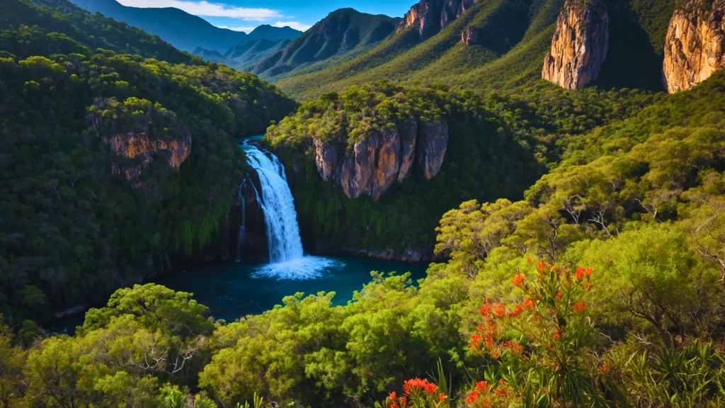a waterfall surrounded by trees and mountains